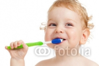 Smiling_kid_brushing_teeth.jpg